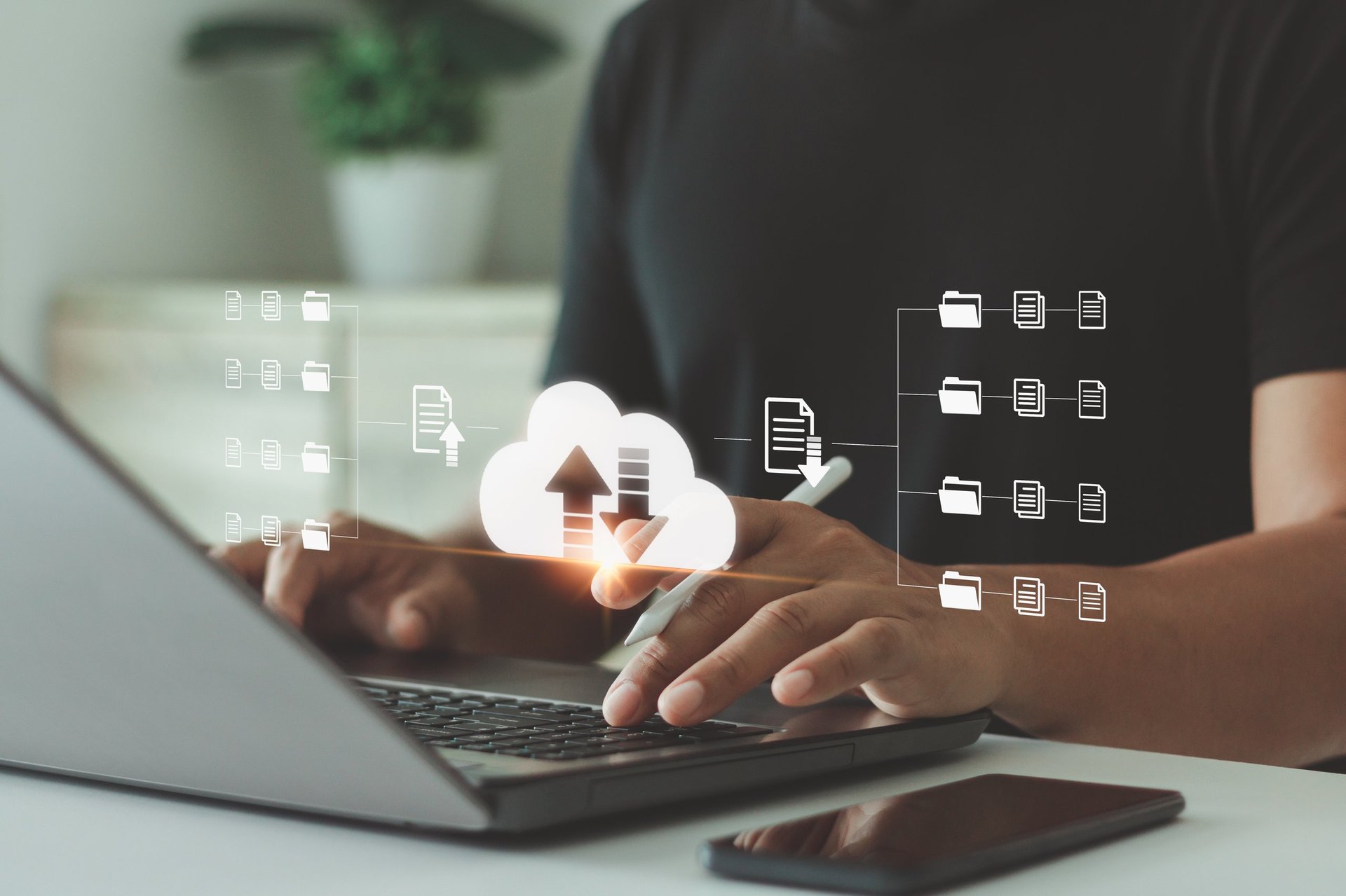 Businessman using laptop with digital cloud storage, cloud computing concept
