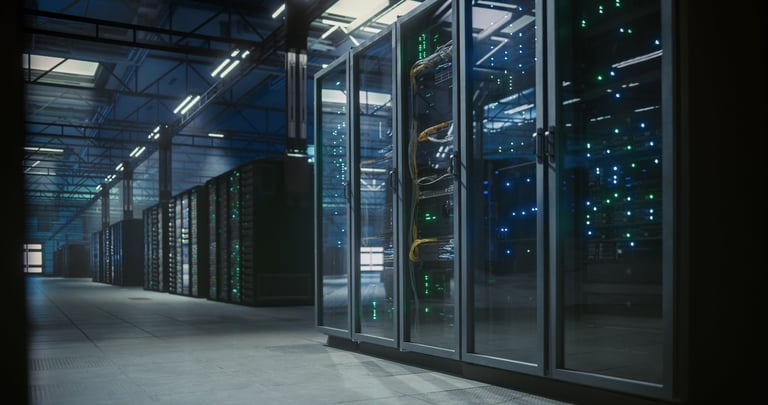 Modern data center server room with long rows of server racks and blinking indicator lights